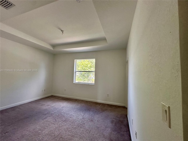 2737 SE 17th St, Homestead, FL 33035 - carpeted spare room with baseboards and a tray ceiling