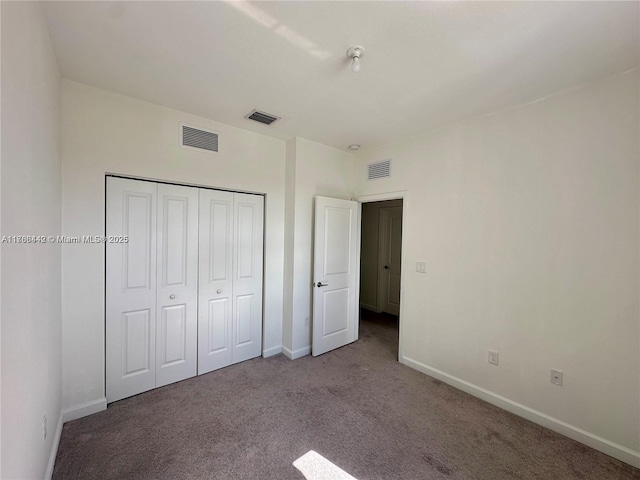 2737 SE 17th St, Homestead, FL 33035 - unfurnished bedroom with carpet floors, baseboards, and a closet