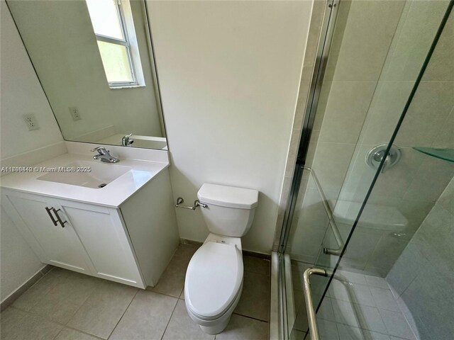 2737 SE 17th St, Homestead, FL 33035 - full bath featuring tile patterned flooring, a shower stall, toilet, vanity, and baseboards