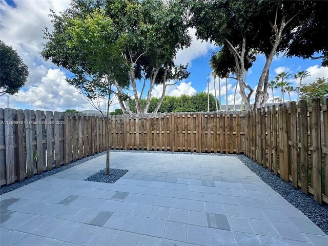 2737 SE 17th St, Homestead, FL 33035 - view of patio with a fenced backyard