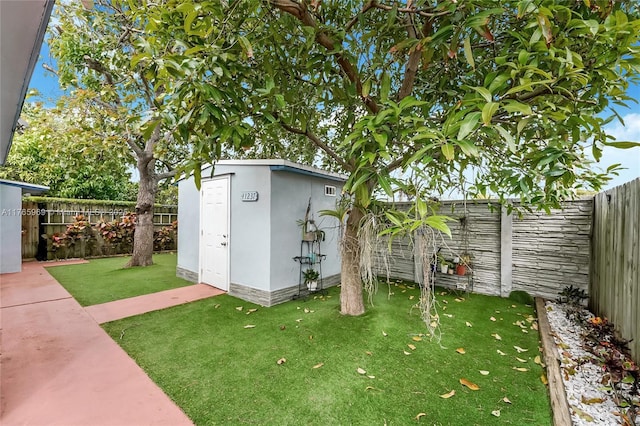 view of shed featuring a fenced backyard