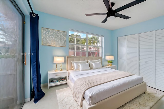 bedroom with a closet, baseboards, and ceiling fan