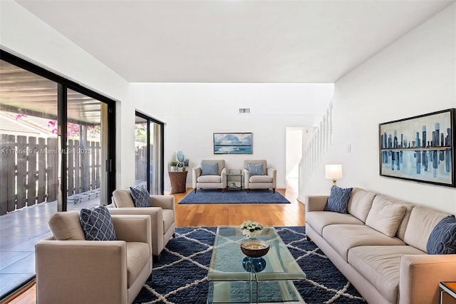 living room with visible vents and wood finished floors