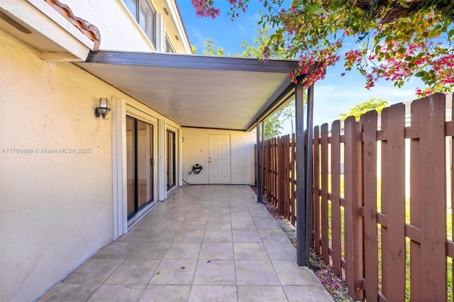 view of patio featuring fence