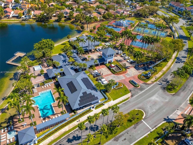 drone / aerial view with a water view and a residential view