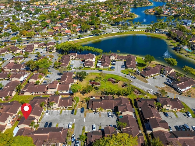 bird's eye view featuring a residential view and a water view