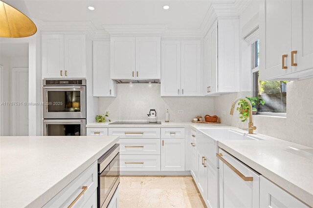 3120 Virginia St Unit 3120, Miami, FL 33133 - kitchen featuring appliances with stainless steel finishes, light countertops, white cabinets, and recessed lighting