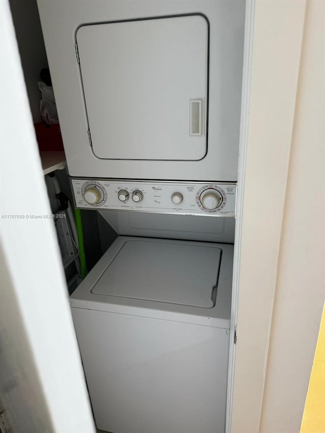 laundry area with laundry area and stacked washer and dryer