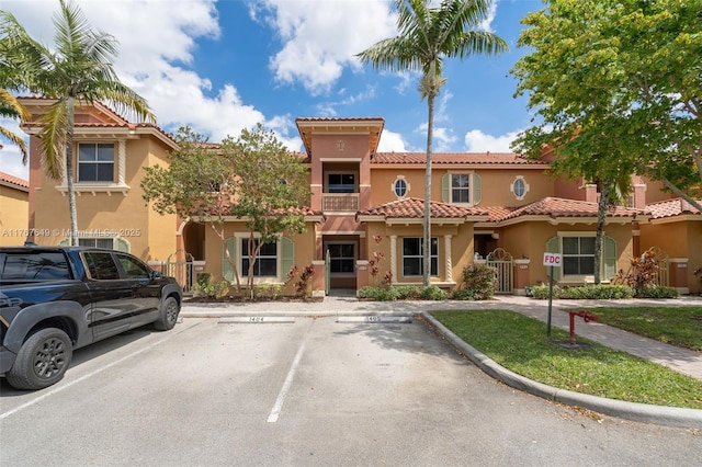 983 SW 143rd Ave Unit 1403, Pembroke Pines, FL 33027 - view of front of property featuring stucco siding and uncovered parking