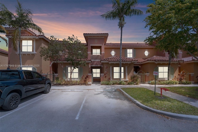 983 SW 143rd Ave Unit 1403, Pembroke Pines, FL 33027 - townhome / multi-family property with stucco siding, uncovered parking, and a tile roof