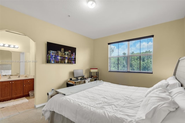 983 SW 143rd Ave Unit 1403, Pembroke Pines, FL 33027 - bedroom with ensuite bath, light tile patterned flooring, and arched walkways