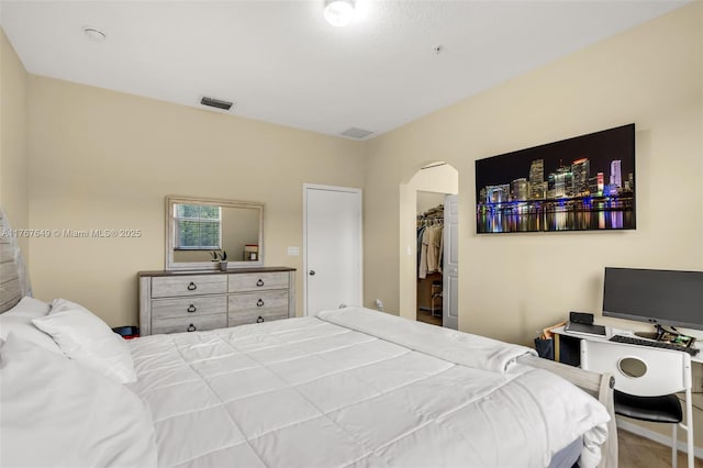 983 SW 143rd Ave Unit 1403, Pembroke Pines, FL 33027 - bedroom featuring arched walkways, a walk in closet, and a closet