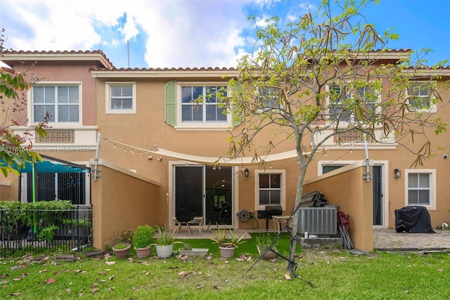 983 SW 143rd Ave Unit 1403, Pembroke Pines, FL 33027 - rear view of property featuring stucco siding and a patio