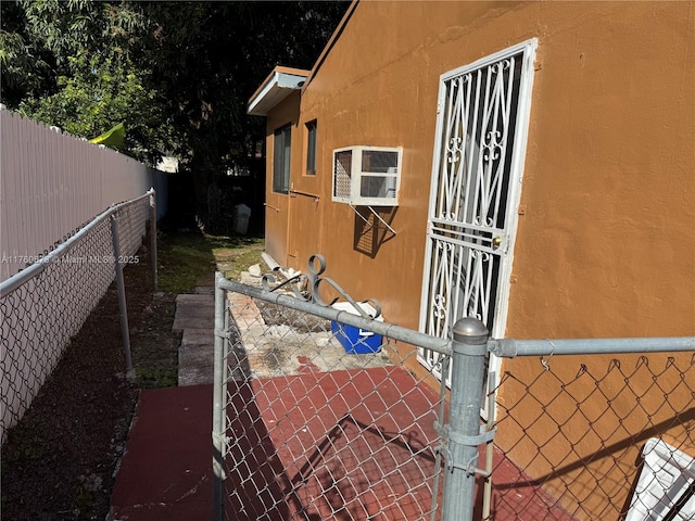 1077 NE 157th Ter, North Miami Beach, FL 33162 - view of side of home featuring a fenced backyard