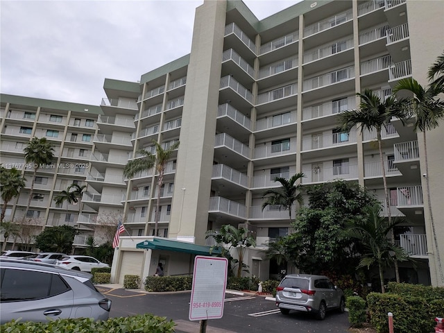 2334 S Cypress Bend Dr Unit 602, Pompano Beach, FL 33069 - view of apartment building / complex with uncovered parking