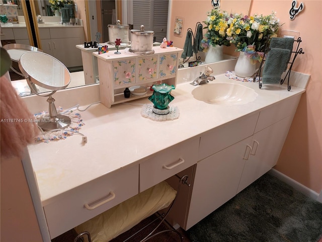 2334 S Cypress Bend Dr Unit 602, Pompano Beach, FL 33069 - bathroom featuring vanity and baseboards