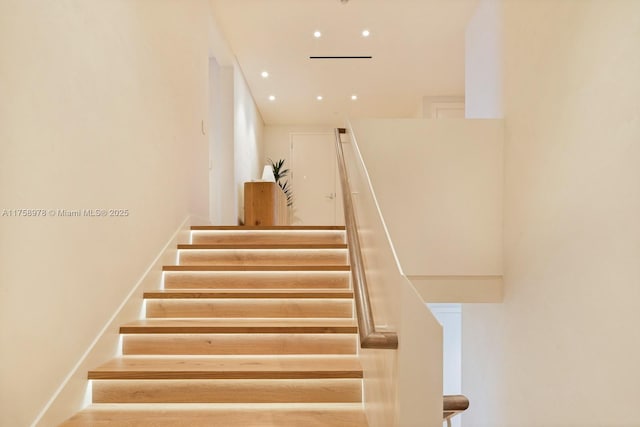 stairway featuring recessed lighting