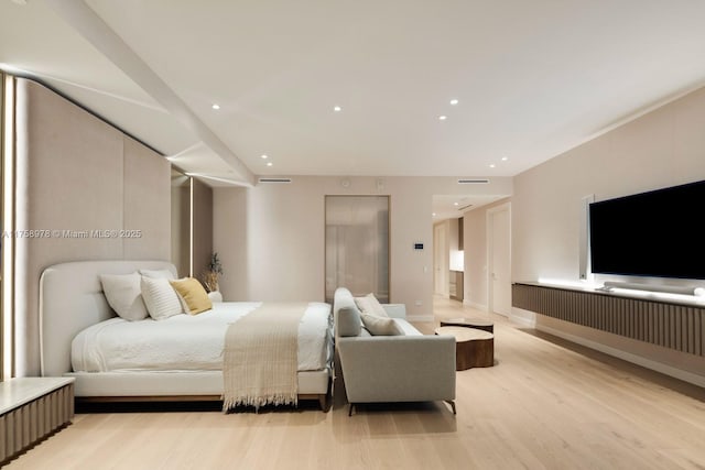 bedroom featuring light wood-style flooring, baseboards, and recessed lighting