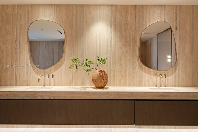 bathroom with double vanity and a sink