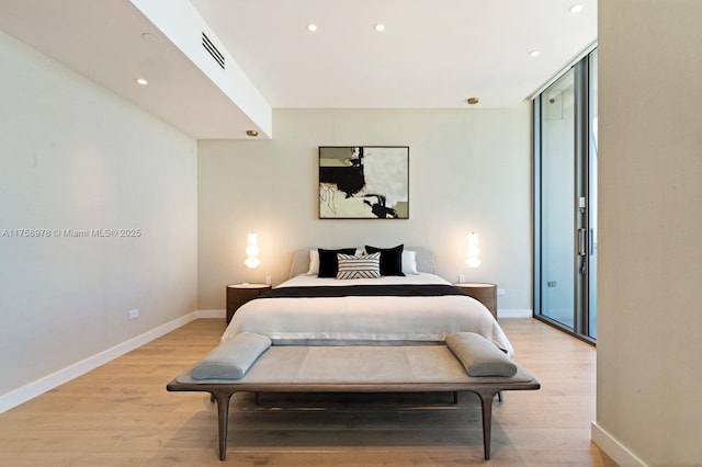 bedroom with light wood-type flooring, baseboards, recessed lighting, and visible vents