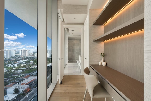 interior space with a view of city and wood finished floors