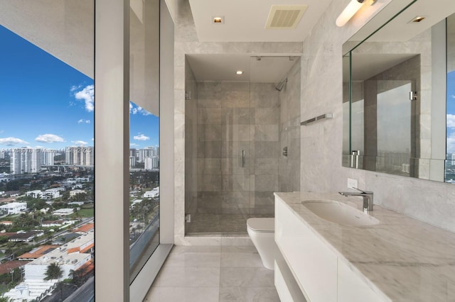 bathroom featuring toilet, a stall shower, visible vents, a city view, and marble finish floor