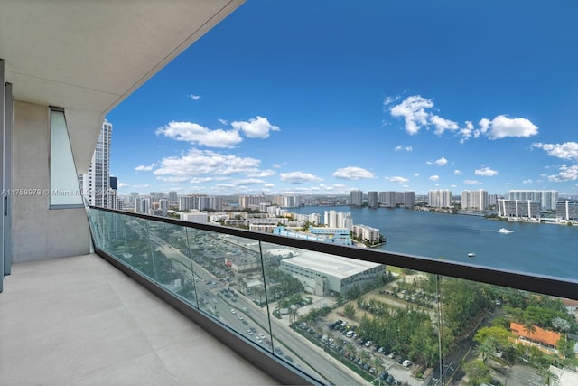 balcony featuring a water view and a view of city