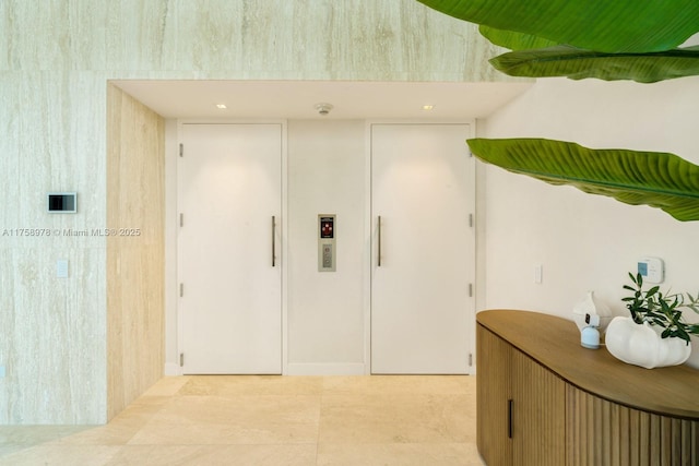 hallway with light tile patterned flooring