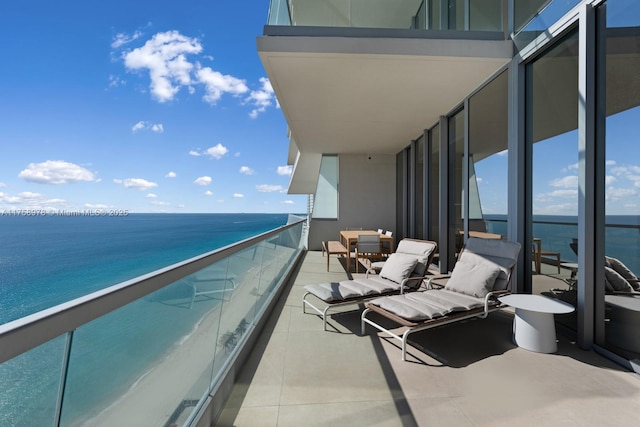 balcony featuring a water view