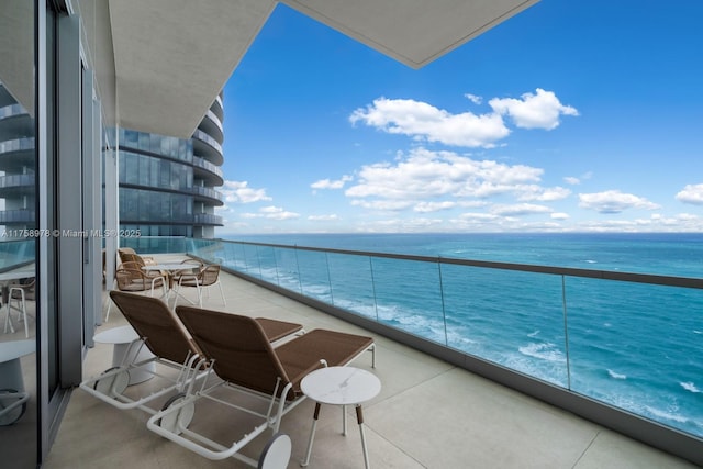 balcony featuring a water view