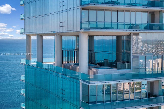 view of building exterior with a water view