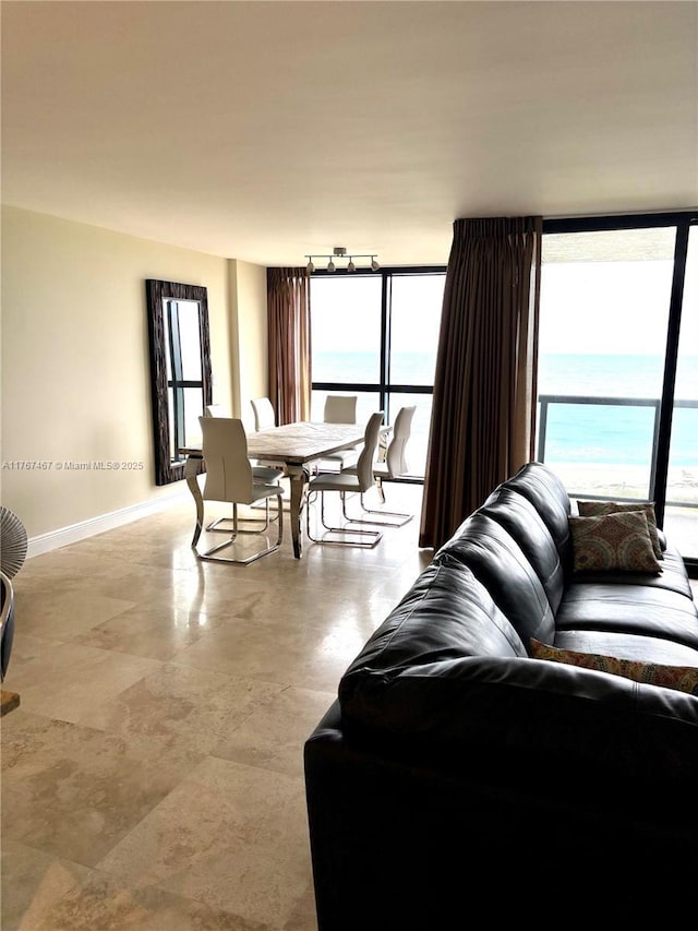 10410 S Ocean Dr Unit 504, Jensen Beach, FL 34957 - living room with a wall of windows and a water view
