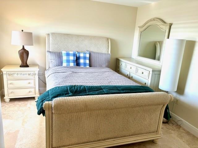 10410 S Ocean Dr Unit 504, Jensen Beach, FL 34957 - carpeted bedroom with baseboards