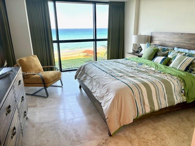 10410 S Ocean Dr Unit 504, Jensen Beach, FL 34957 - bedroom with a water view