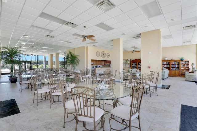 10410 S Ocean Dr Unit 504, Jensen Beach, FL 34957 - dining room featuring a ceiling fan and a drop ceiling