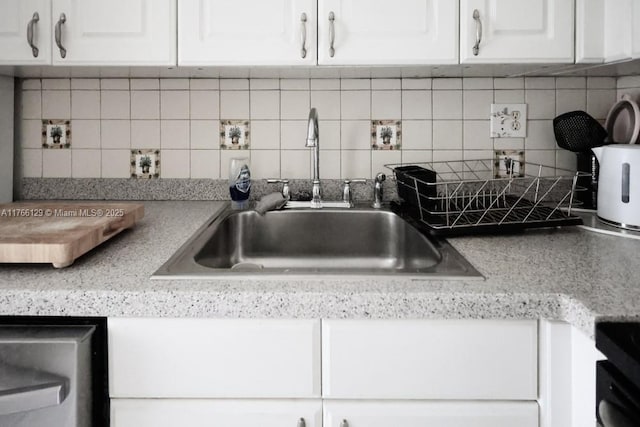 10772 N Kendall Dr Unit G5, Miami, FL 33176 - kitchen view of a sink, white cabinets, tasteful backsplash, dishwasher, and light countertops