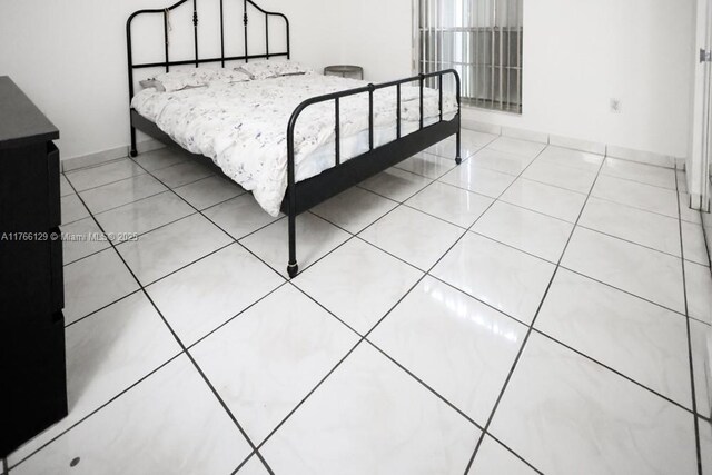 10772 N Kendall Dr Unit G5, Miami, FL 33176 - tiled bedroom featuring baseboards