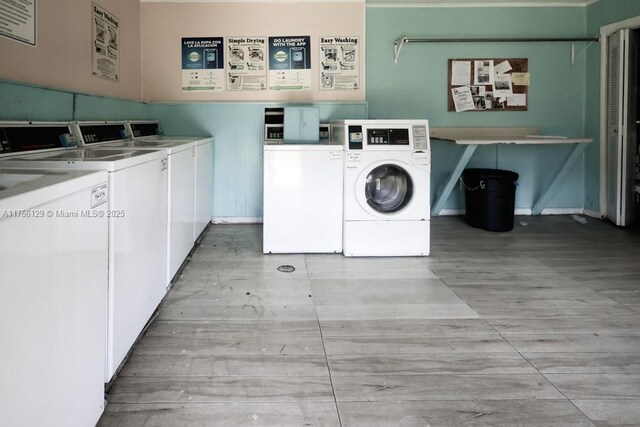 10772 N Kendall Dr Unit G5, Miami, FL 33176 - shared laundry room featuring washer and clothes dryer, light wood-type flooring, and baseboards