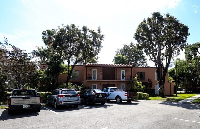 10772 N Kendall Dr Unit G5, Miami, FL 33176 - view of front of property with uncovered parking, a tiled roof, and stucco siding