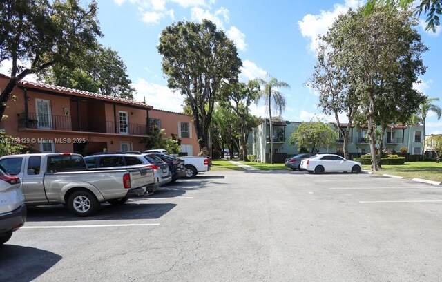 10772 N Kendall Dr Unit G5, Miami, FL 33176 - uncovered parking lot featuring a residential view