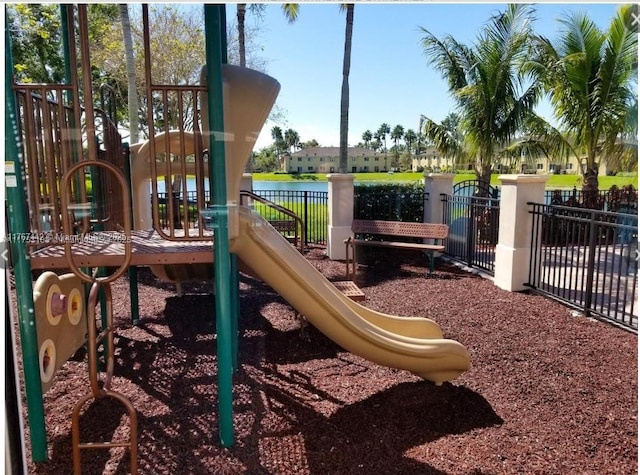 communal playground featuring fence