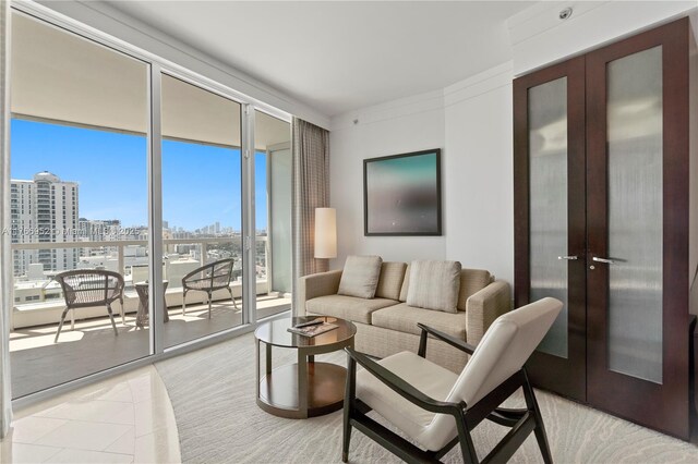 4391 Collins Ave Unit 1618, Miami Beach, FL 33140 - living area with light tile patterned flooring, a view of city, french doors, and a wall of windows