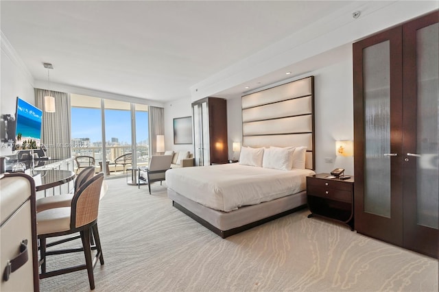 4391 Collins Ave Unit 1618, Miami Beach, FL 33140 - carpeted bedroom featuring crown molding, access to outside, and expansive windows
