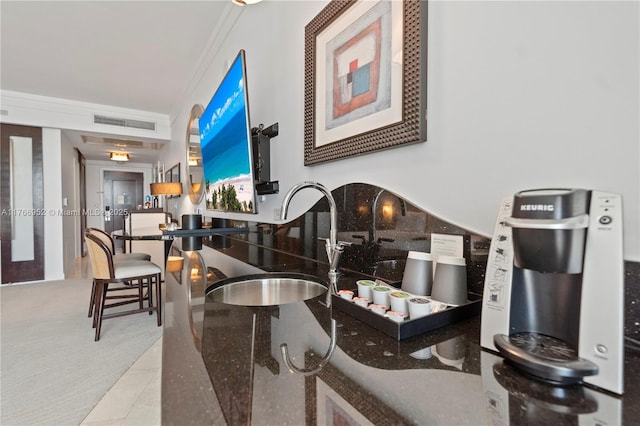 4391 Collins Ave Unit 1618, Miami Beach, FL 33140 - interior space with a sink, dark stone countertops, visible vents, ornamental molding, and carpet
