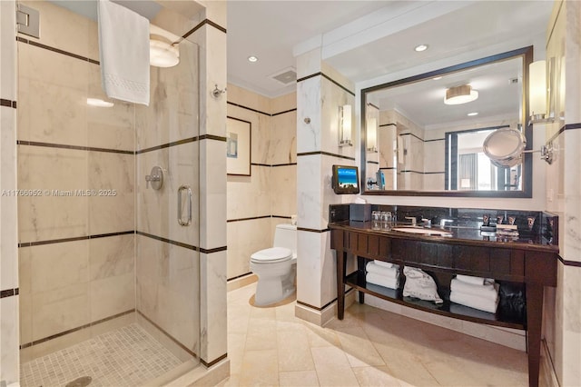 4391 Collins Ave Unit 1618, Miami Beach, FL 33140 - full bath featuring tile walls, visible vents, toilet, vanity, and a stall shower