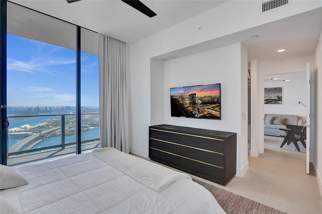 601 NE 1st Ave Unit 5115, Miami, FL 33132 - bedroom featuring a wall of windows, a ceiling fan, baseboards, and light tile patterned floors