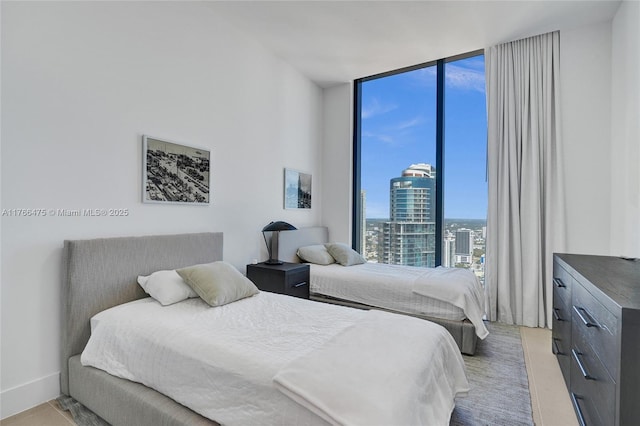 601 NE 1st Ave Unit 5115, Miami, FL 33132 - bedroom with a wall of windows and a view of city