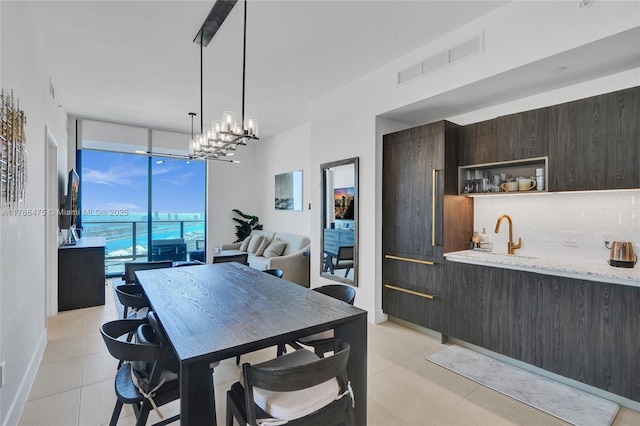 601 NE 1st Ave Unit 5115, Miami, FL 33132 - dining area with expansive windows, light tile patterned flooring, and a chandelier