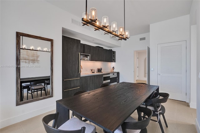 601 NE 1st Ave Unit 5115, Miami, FL 33132 - dining area featuring a chandelier, light tile patterned flooring, and baseboards