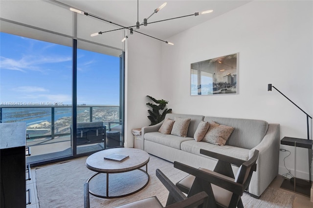 601 NE 1st Ave Unit 5115, Miami, FL 33132 - living room featuring a wall of windows and a chandelier
